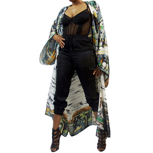 A woman models a luxury Japanese kimono robe in white with black trim, featuring subtle yellow and green tones with an abstract urban skyline design.