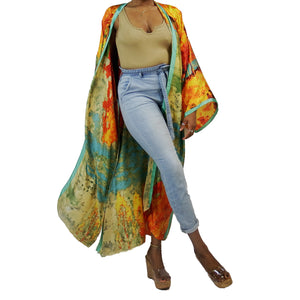 A woman models a flowing kimono robe in green and gold, featuring an abstract art print and mint-colored trim. The kimono jacket drapes elegantly.

A woman showcases a green and gold kimono robe with a striking abstract art print and mint-colored trim, highlighting the flowing fit of the kimono cardigan.