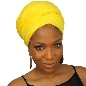 A woman models a bright yellow jersey knit stretch African headwrap, offering a bold and vibrant style with a soft, stretchy fit for comfort and versatility.