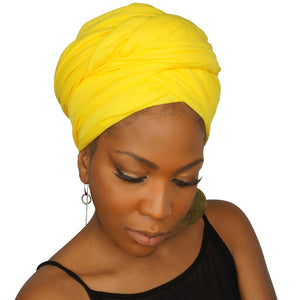 A woman models a bright yellow jersey knit stretch African headwrap, offering a bold and vibrant style with a soft, stretchy fit for comfort and versatility.